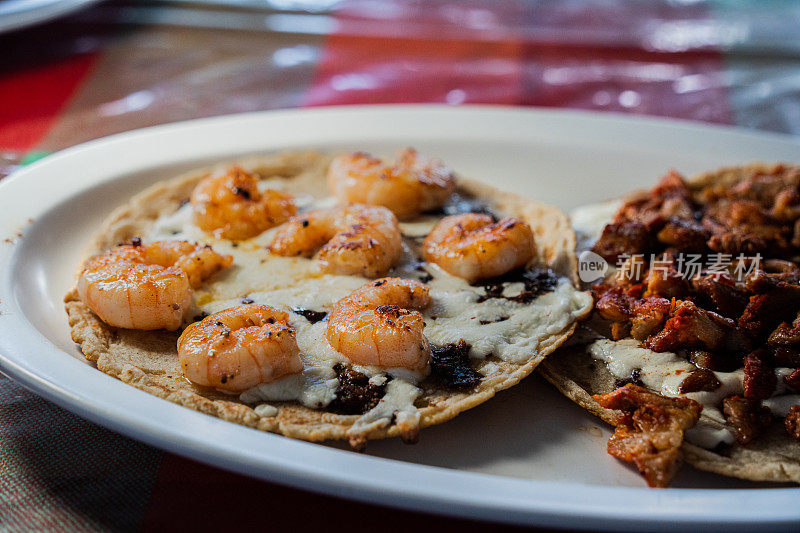 Gourmet Grilled Shrimp Taco with Sautéed Vegetables, Corn Tortilla and Melted Cheese at an Open Air Restaurant in Tijuana, Mexico